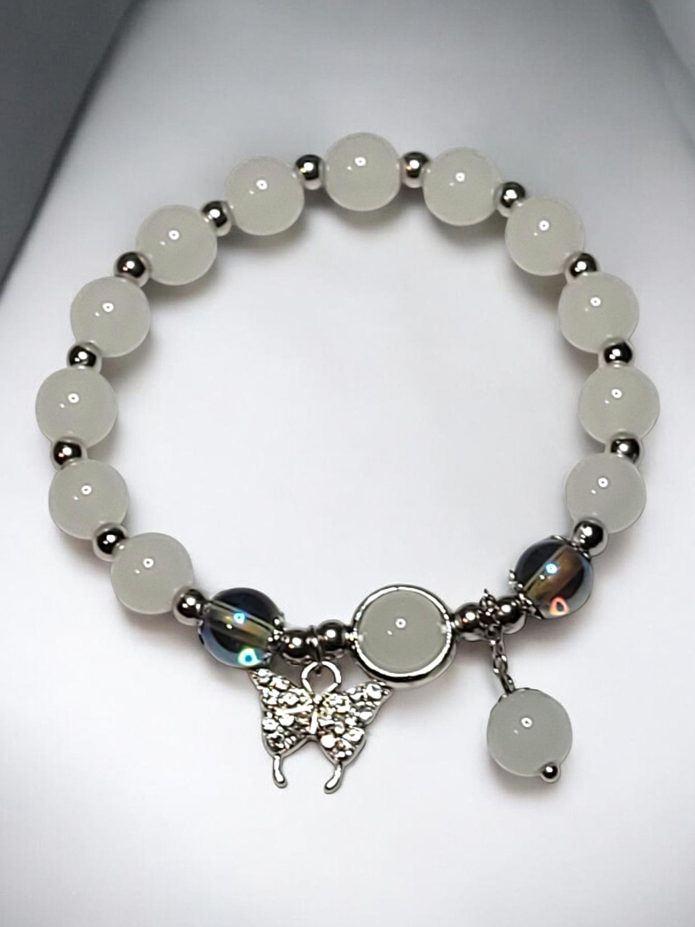 White Beaded Bracelet with Silver Butterfly Charm